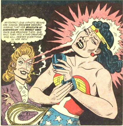 The devious Paula  hypnotises Wonder Woman! into thinking her bracelets are barbed wire!