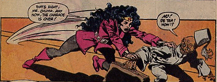 Wonder Woman, who has been playing possum all along, leaps to her feet and grabs the surprised Chuma!