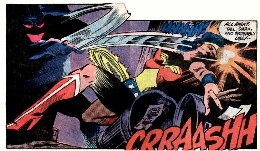 Before Wonder Woman can react she is struck across the face and sent crashing into some trash cans.